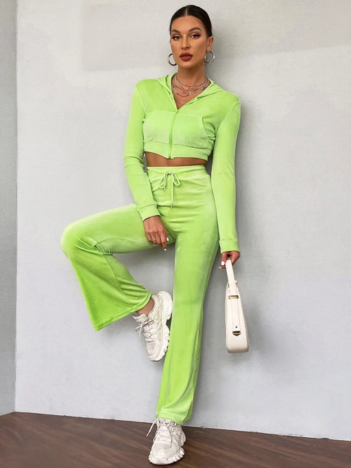 Professional AI Product Photography for Lounge Sets with Studio Model featuring Black Model wearing Lounge Sets in Minimalist Gray Studio Wall, Trendy and Confident style.