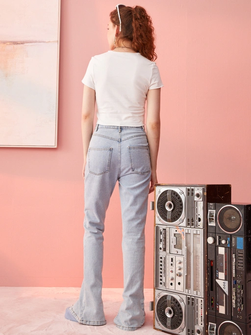 Professional AI Product Photography featuring Studio Model wearing Jeans in minimalist studio with pink backdrop, Professional style.
